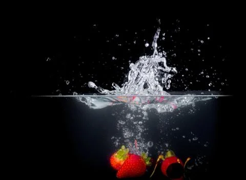 Fruit Splashing into water. Stock Photos