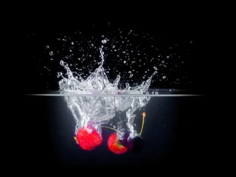 Fruit Splashing into water. Stock Photos