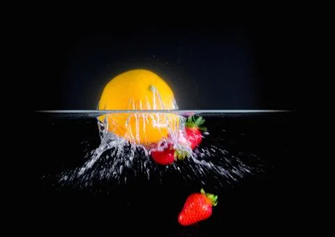 Fruit Splashing into water. Stock Photos