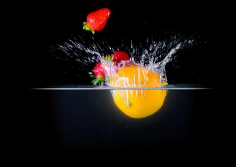 Fruit Splashing into water. Stock Photos