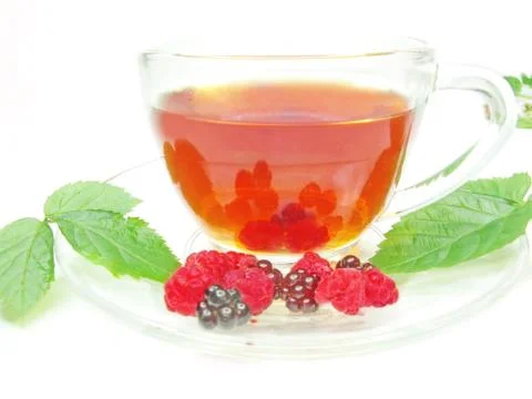 Fruit summer tea with raspberry and blackberry Stock Photos