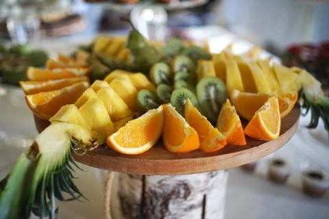 Fruit table. Grapes, pineapples, oranges, apples and others. Stock Photos