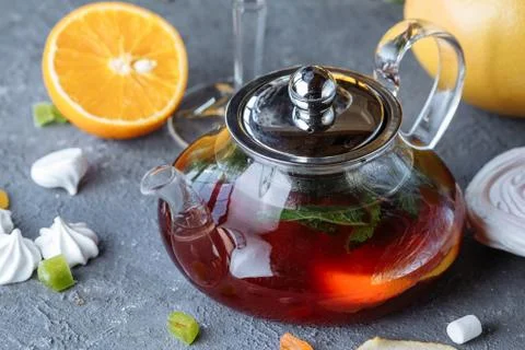 Fruit tea with mint, oranges and cranberries on a decorative background. Hot  Foto stock