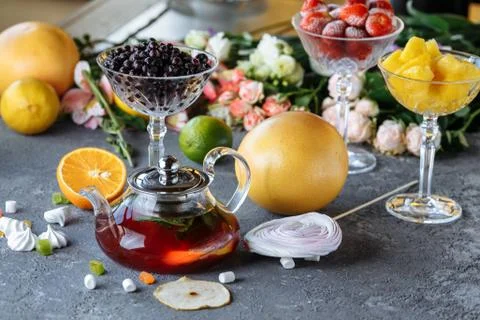 Fruit tea with mint, oranges and cranberries on a decorative background. Hot  Foto stock