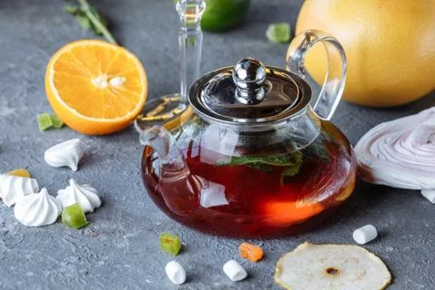 Fruit tea with mint, oranges and cranberries on a decorative background. Hot  Stock Photos