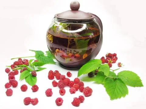 Fruit tea with raspberry in teapot Stock Photos