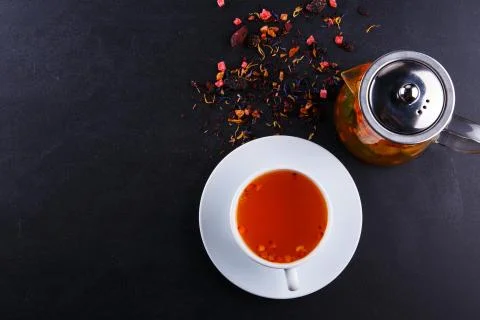 Fruit tea with slice of lemon. Mixture herbal floral fruit tea with petals, dry Stock Photos