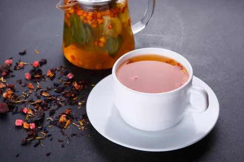 Fruit tea with slice of lemon. Mixture herbal floral fruit tea with petals, dry Stock Photos