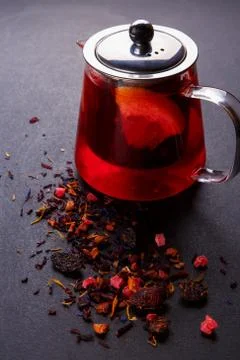 Fruit tea with slice of lemon. Mixture herbal floral fruit tea with petals, dry Stock Photos