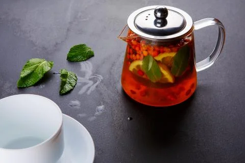 Fruit tea with slice of lemon. Mixture herbal floral fruit tea with petals, dry Stock Photos