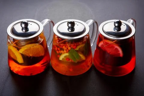 Fruit tea with slice of lemon. Mixture herbal floral fruit tea with petals, dry Stock Photos