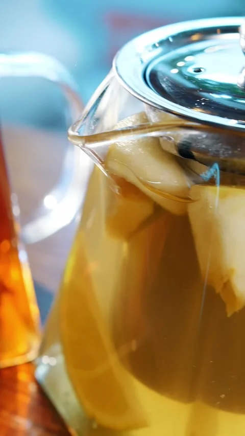 Fruit tea in a teapot. herbal tea. tea drink. close-up. three glass teapots with 스톡 동영상 323513886