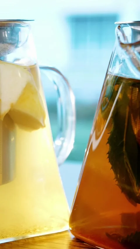 Fruit tea in a teapot. herbal tea. tea drink. close-up. three glass teapots with Stock Footage 323513901