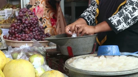 Fruit traders serving and transacting Stock Footage 210076449