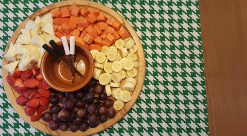 Fruit tray on patterned tablecloth Stock Photos