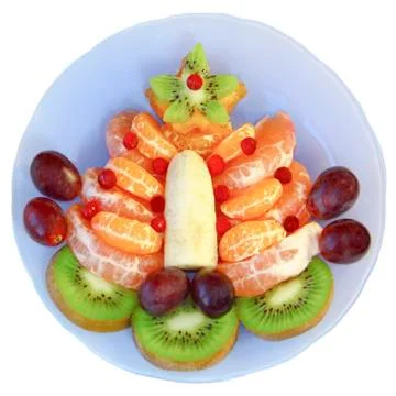 Fruit tree on a blue plate on a white background Stock Photos