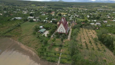 Fruit Trees And Gardens Surround Red Catholic Church In Countryside Kon Tum Stock Footage 341456622