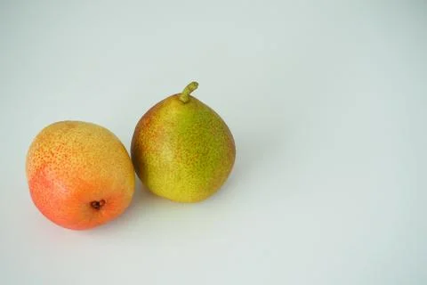 Fruit. Two pears close-up on a white background. Stock Photos