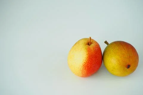 Fruit. Two pears close-up on a white background. Stock Photos