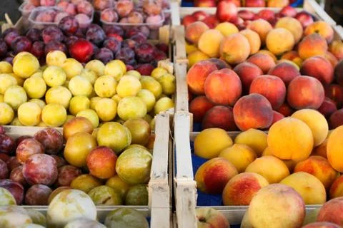 Fruit in wooden boxes Stock Photos