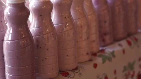Fruit yogurt drinks Stock Footage 80613948