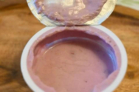 Fruit yogurt in open cup 스톡 사진