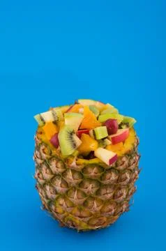 Fruitcocktail in pineapple Stock Photos