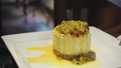 Fruitful Bliss: Passion Fruit Mousse in Exquisite Presentation Stock Footage 258294064