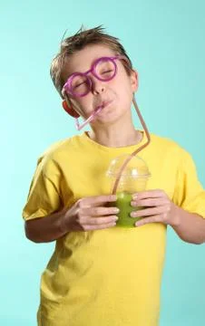 Fruitilicious - boy drinking through a crazy straw Stock Photos