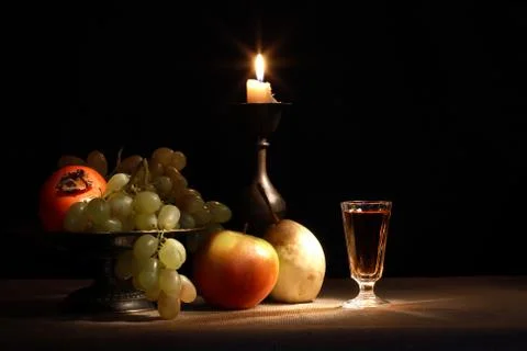 Fruits and candle Stock-Fotos
