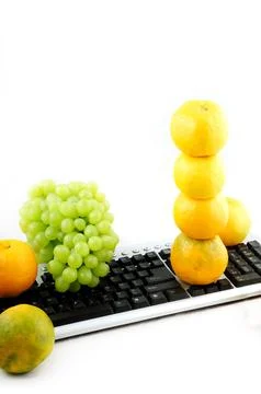 Fruits and computer keyboard 写真素材