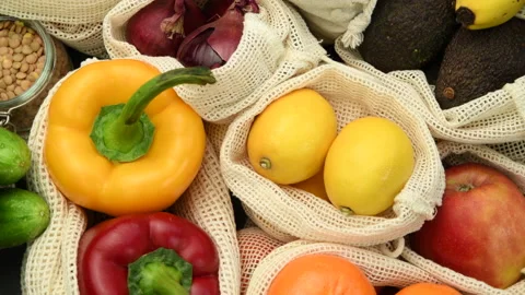 Fruits and vegetables in eco friendly reusable cotton bags Stock Footage 149355342