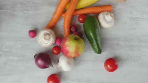 Fruits and vegetables fall out paper bag Stock Footage 233882052