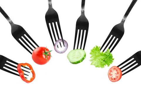 Fruits and vegetables on fork Stock Photos