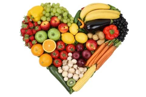Fruits and vegetables forming heart love topic and healthy eating Stock Photos