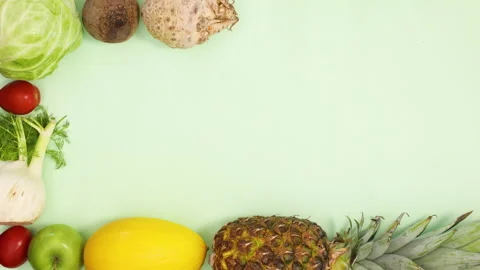 Fruits and vegetables make creative frame for text. Stop motion Stock Footage 154522827
