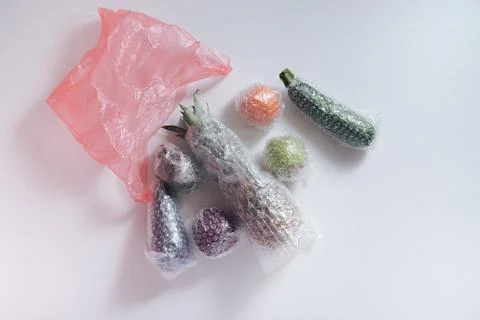 Fruits and vegetables packaged in plastic wrap Stock Photos