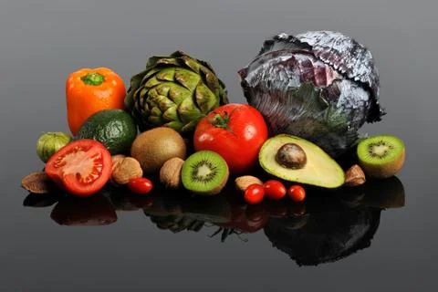 Fruits and Vegetables on Reflective Table Foto stock