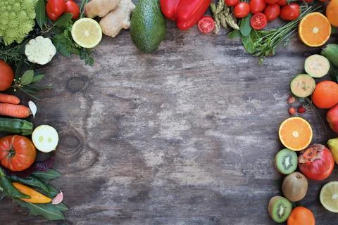 Fruits and vegetables on rustic background Stock Photos