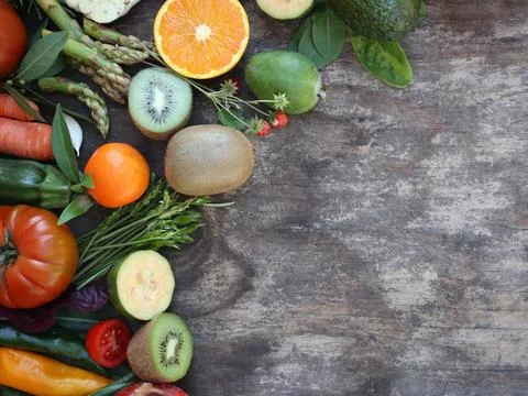 Fruits and vegetables on rustic background Stock Photos