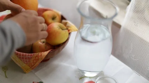The fruits are on the table and are touched by the owner Stock Footage 116560274