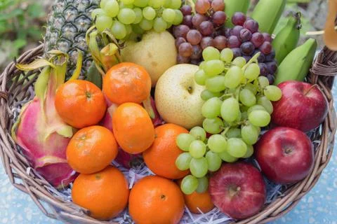Fruits in basket Stock Photos