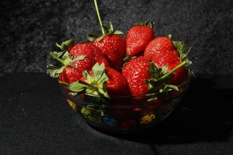 Fruits, berries, vegetables, vitamins on a black background Stock Photos