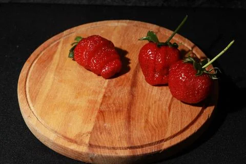 Fruits, berries, vegetables, vitamins on a black background Stock Photos