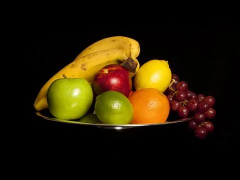 Fruits on black Stock Photos