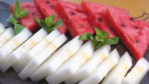 The fruits is on a black plate. Stock Footage 131131618