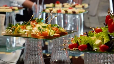 Fruits, cakes, and sweets on a festive banquet table Stock Footage 346297553
