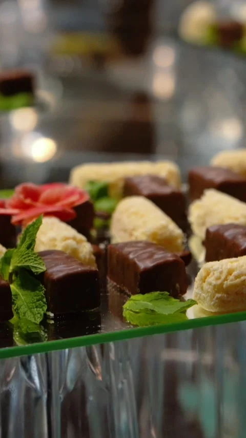Fruits, cakes, and sweets on a festive banquet table Stock Footage 346297628
