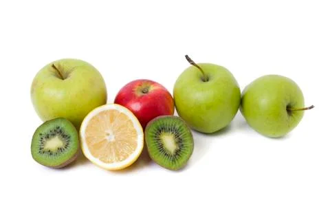 Fruits in a composition on a white background. Lemon with apples and kiwi on Stock Photos