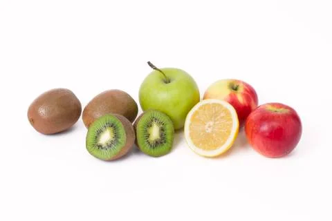 Fruits in a composition on a white background. Lemon with apples and kiwi on Stock-Fotos